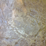 Stamped concrete natural wet rock look - close up